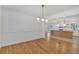 Dining room area boasts newly refinished hardwoods with easy kitchen access at 3819 Dora Se Dr, Smyrna, GA 30082