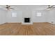 Bright living room features refinished hardwoods and a charming white brick fireplace at 3819 Dora Se Dr, Smyrna, GA 30082