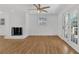 Living room features refinished hardwoods, a charming fireplace, and backyard access at 3819 Dora Se Dr, Smyrna, GA 30082