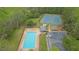 Aerial view of community amenities, including a pool, tennis courts, a playground, and parking at 4495 Sagebrush Nw Dr, Kennesaw, GA 30152