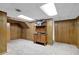 Finished basement with wood paneling, storage, and carpet, offering a versatile space for various activities at 4495 Sagebrush Nw Dr, Kennesaw, GA 30152