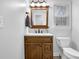 Updated bathroom showcasing a wood vanity with marble countertop and modern fixtures at 4495 Sagebrush Nw Dr, Kennesaw, GA 30152