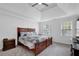 Bedroom featuring a large bed with a decorative blanket and two windows at 4495 Sagebrush Nw Dr, Kennesaw, GA 30152