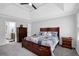 Relaxing bedroom with gray carpet, neutral walls, and white trim features a ceiling fan and wood furniture at 4495 Sagebrush Nw Dr, Kennesaw, GA 30152