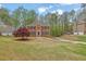 Classic two-story home with a brick facade, symmetrical design, and a well-maintained lawn at 4495 Sagebrush Nw Dr, Kennesaw, GA 30152