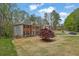 Brick front home showcasing a well-manicured lawn and mature trees surrounding the property at 4495 Sagebrush Nw Dr, Kennesaw, GA 30152