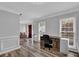 Home office featuring hardwood floors, light walls, and natural light from large windows at 4495 Sagebrush Nw Dr, Kennesaw, GA 30152