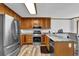 Kitchen featuring stainless steel appliances, wood cabinets, and granite countertops at 4495 Sagebrush Nw Dr, Kennesaw, GA 30152
