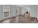 Spacious living room with light gray walls, hardwood floors, and natural light at 4495 Sagebrush Nw Dr, Kennesaw, GA 30152