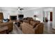 Open-concept living room with a brick fireplace, neutral paint, and comfortable furniture at 4495 Sagebrush Nw Dr, Kennesaw, GA 30152
