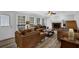 Living room with a brick fireplace, neutral paint, and a comfortable seating arrangement at 4495 Sagebrush Nw Dr, Kennesaw, GA 30152