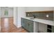 Stylish bar area featuring a sink, wine cooler, and plenty of storage space for a beverage center at 478 Majestic Oaks Pl, Smyrna, GA 30082