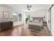 Serene bedroom with neutral tones, hardwood floors, ample natural light, and a modern ceiling fan at 478 Majestic Oaks Pl, Smyrna, GA 30082