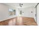 Bright bedroom featuring hardwood floors, large windows, modern ceiling fan and board and batten accent wall at 478 Majestic Oaks Pl, Smyrna, GA 30082
