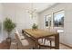 Charming dining room with modern lighting, wainscoting and bright windows at 478 Majestic Oaks Pl, Smyrna, GA 30082