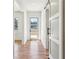 Inviting hallway with hardwood floors, sliding doors and a view of the front door at 478 Majestic Oaks Pl, Smyrna, GA 30082