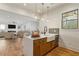 Stylish kitchen featuring an island with sink and seating, open to the living room at 478 Majestic Oaks Pl, Smyrna, GA 30082