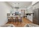 Modern kitchen with stainless steel appliances, an island with seating, and hardwood floors at 478 Majestic Oaks Pl, Smyrna, GA 30082