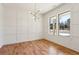 Bright living room with modern lighting, hardwood floors, large windows, and stylish wall trim at 478 Majestic Oaks Pl, Smyrna, GA 30082