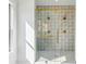 Close up of a shower with eye-catching patterned tile and gold hardware at 478 Majestic Oaks Pl, Smyrna, GA 30082