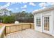 Wood deck provides a view of the backyard, trees, and a storage shed under a partly cloudy sky at 636 Ginger Cake Rd, Fayetteville, GA 30214