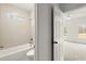 A view into the bathroom showcases a shower and tub combination with white subway tile at 636 Ginger Cake Rd, Fayetteville, GA 30214