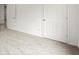 Bedroom features light gray carpet, white walls and view of two white paneled doors at 636 Ginger Cake Rd, Fayetteville, GA 30214
