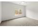 Bedroom with a ceiling fan and large window providing lots of natural light at 636 Ginger Cake Rd, Fayetteville, GA 30214
