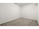 An empty bedroom shows gray carpeting and white walls, with multiple electrical outlets at 636 Ginger Cake Rd, Fayetteville, GA 30214