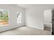 Bedroom with neutral carpet, ceiling fan, and view into the bathroom at 636 Ginger Cake Rd, Fayetteville, GA 30214