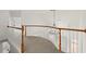 Upstairs hallway with carpet and wood trim overlooking the living room at 636 Ginger Cake Rd, Fayetteville, GA 30214