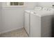 Clean and tidy laundry area features modern appliances and stylish patterned tile flooring at 636 Ginger Cake Rd, Fayetteville, GA 30214