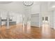 Open floor plan with hardwood floors, a gray island kitchen, and white built-in cabinetry at 636 Ginger Cake Rd, Fayetteville, GA 30214