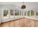 Bright sunroom with many large windows provides relaxing and scenic views of surrounding landscape at 636 Ginger Cake Rd, Fayetteville, GA 30214