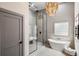 Modern main bathroom with walk-in shower, soaking tub, and pendant lighting at 1035 Walker Se Ave, Atlanta, GA 30316