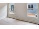 Bedroom features clean lines, neutral walls, and natural light flooding in from two windows at 1035 Walker Se Ave, Atlanta, GA 30316
