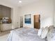 Bedroom boasting neutral walls, high ceilings, stylish decor, and a cozy bed with decorative pillows at 1035 Walker Se Ave, Atlanta, GA 30316