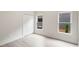 Neutral bedroom with two windows and a closet door bathed in natural light at 1035 Walker Se Ave, Atlanta, GA 30316