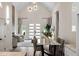 Bright dining area with modern lighting and a view of the adjacent living room with fireplace at 1035 Walker Se Ave, Atlanta, GA 30316