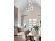 Beautiful dining area featuring statement lighting and access to the adjacent living room with modern fireplace at 1035 Walker Se Ave, Atlanta, GA 30316
