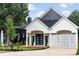 Charming home with white trim, black roof, well-maintained yard and modern mailbox at 1035 Walker Se Ave, Atlanta, GA 30316