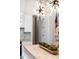 Bright kitchen features white cabinets, marble backsplash, and unique pendant lighting at 1035 Walker Se Ave, Atlanta, GA 30316