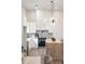 Modern kitchen with sleek white cabinets, stainless steel appliances, island and marble countertops at 1035 Walker Se Ave, Atlanta, GA 30316