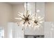 Statement lighting fixture with many bulbs illuminates the modern kitchen at 1035 Walker Se Ave, Atlanta, GA 30316