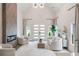 Airy living room featuring vaulted ceilings, fireplace, large windows, and modern decor at 1035 Walker Se Ave, Atlanta, GA 30316