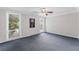Bedroom featuring blue carpet and natural light from the two windows at 1088 Riverbend Club Se Dr, Atlanta, GA 30339