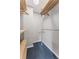 Walk-in closet with carpet flooring and wooden shelves with clothing hangers at 1088 Riverbend Club Se Dr, Atlanta, GA 30339