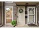 Charming entrance with decorative wreath, covered porch, and well-maintained exterior at 1088 Riverbend Club Se Dr, Atlanta, GA 30339