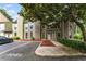 Charming townhome featuring a welcoming entrance, well-maintained landscaping, and convenient parking at 1088 Riverbend Club Se Dr, Atlanta, GA 30339