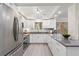 Well-equipped kitchen with stainless steel appliances, gray countertops, and ample storage at 1088 Riverbend Club Se Dr, Atlanta, GA 30339